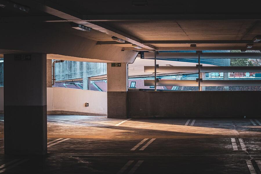An opening in a parking deck letting in daylight